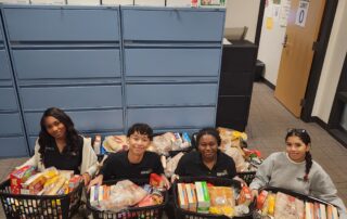 National Honor Society Members with the 13 Complete Holiday Meals we collected
